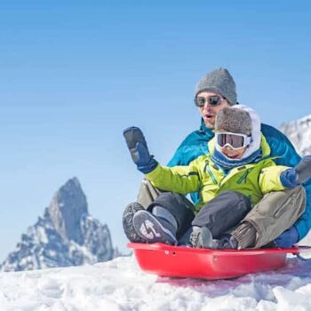 Father with son sledding